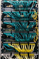 a rack of servers with wires and wires attached to them