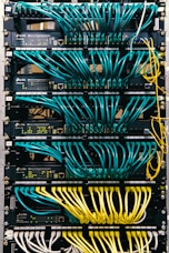 a rack of servers with wires and wires attached to them