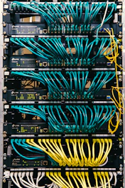 a rack of servers with wires and wires attached to them