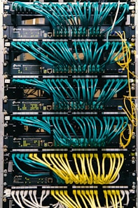 a rack of servers with wires and wires attached to them