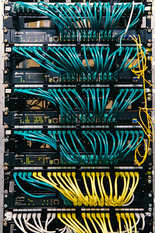 a rack of servers with wires and wires attached to them