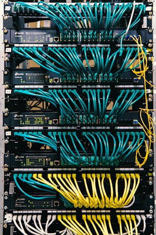 a rack of servers with wires and wires attached to them