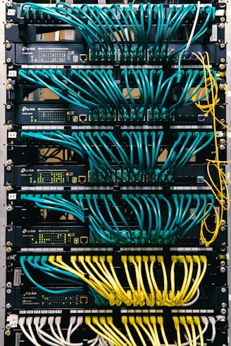 a rack of servers with wires and wires attached to them