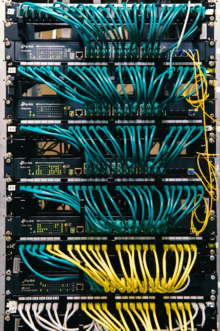 a rack of servers with wires and wires attached to them