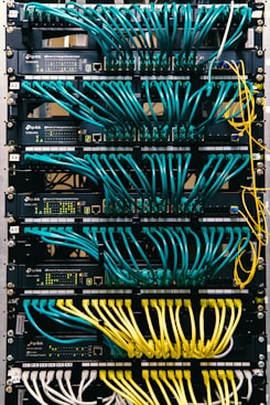 a rack of servers with wires and wires attached to them