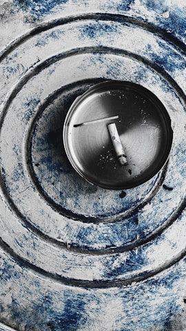 An artistic ashtray featuring intricate designs and patterns.