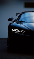 a black sports car parked in a garage