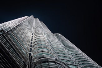 A sleek, dark-toned image of a luxury modern building with gold highlights