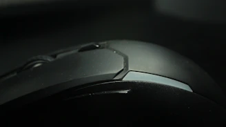 Close-up of stylish ceramic computer accessories with glossy finish on a vivid surface