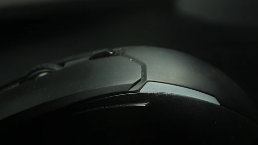 Close-up of stylish ceramic computer accessories with glossy finish on a vivid surface
