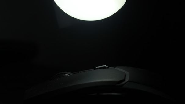 Close-up of a button with zoom and brightness hover effect in a dark tech-themed interface.