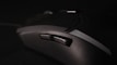 Dynamic shot of a gamer’s hand gripping a high-precision gaming mouse on a textured mousepad.