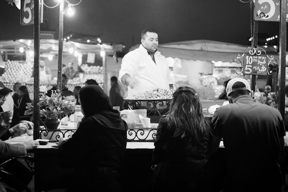 a group of people sitting around a table