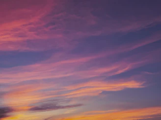 A vibrant fantasy landscape with interstellar colors blending into a serene night.