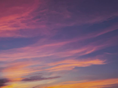 A vibrant fantasy landscape with interstellar colors blending into a serene night.