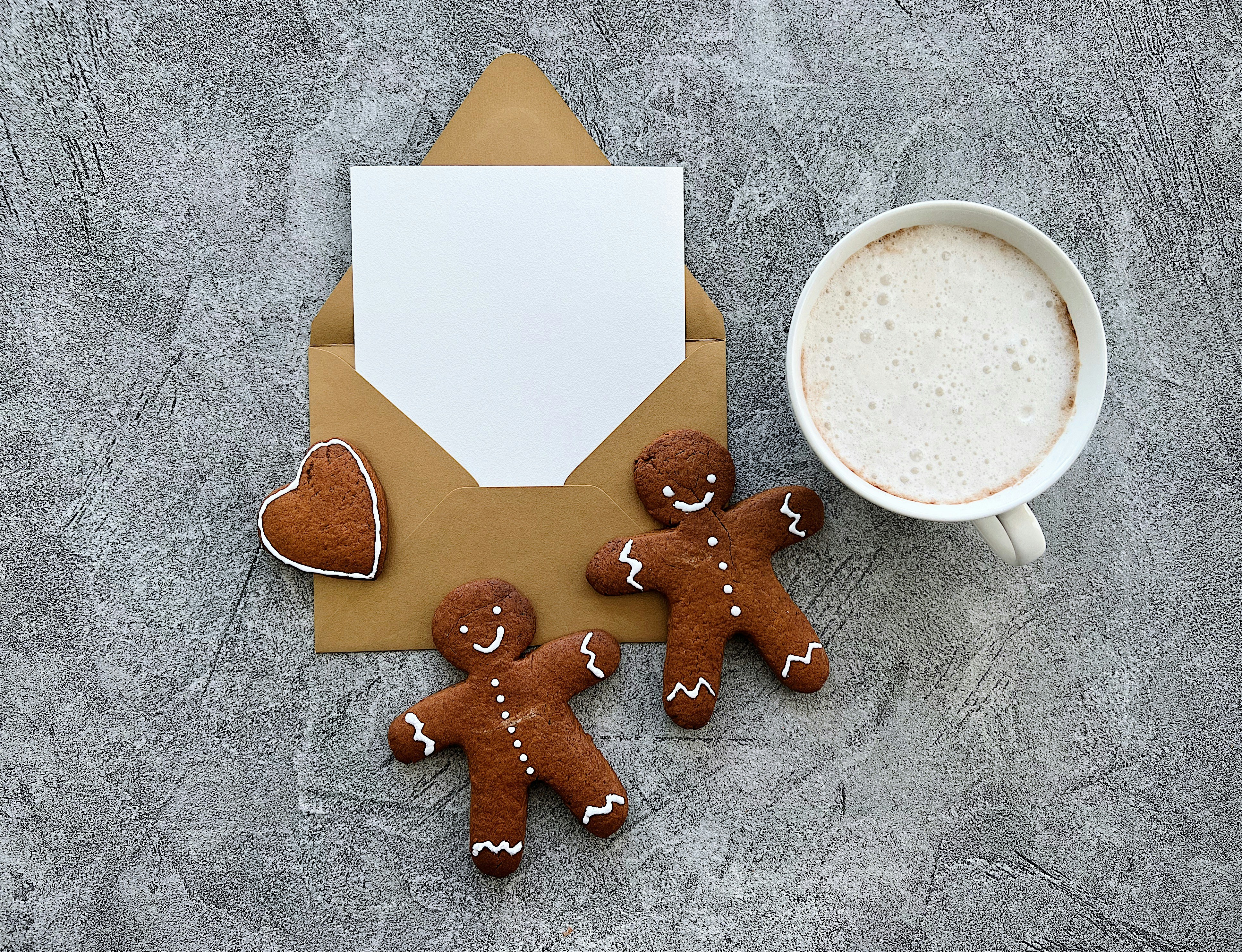 a cup of coffee and some cookies on a table