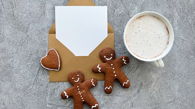 a cup of coffee and some cookies on a table