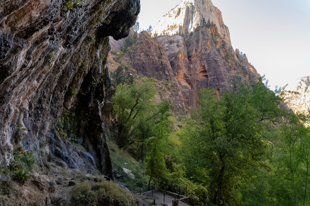 a view of a mountain with a bridge going through it