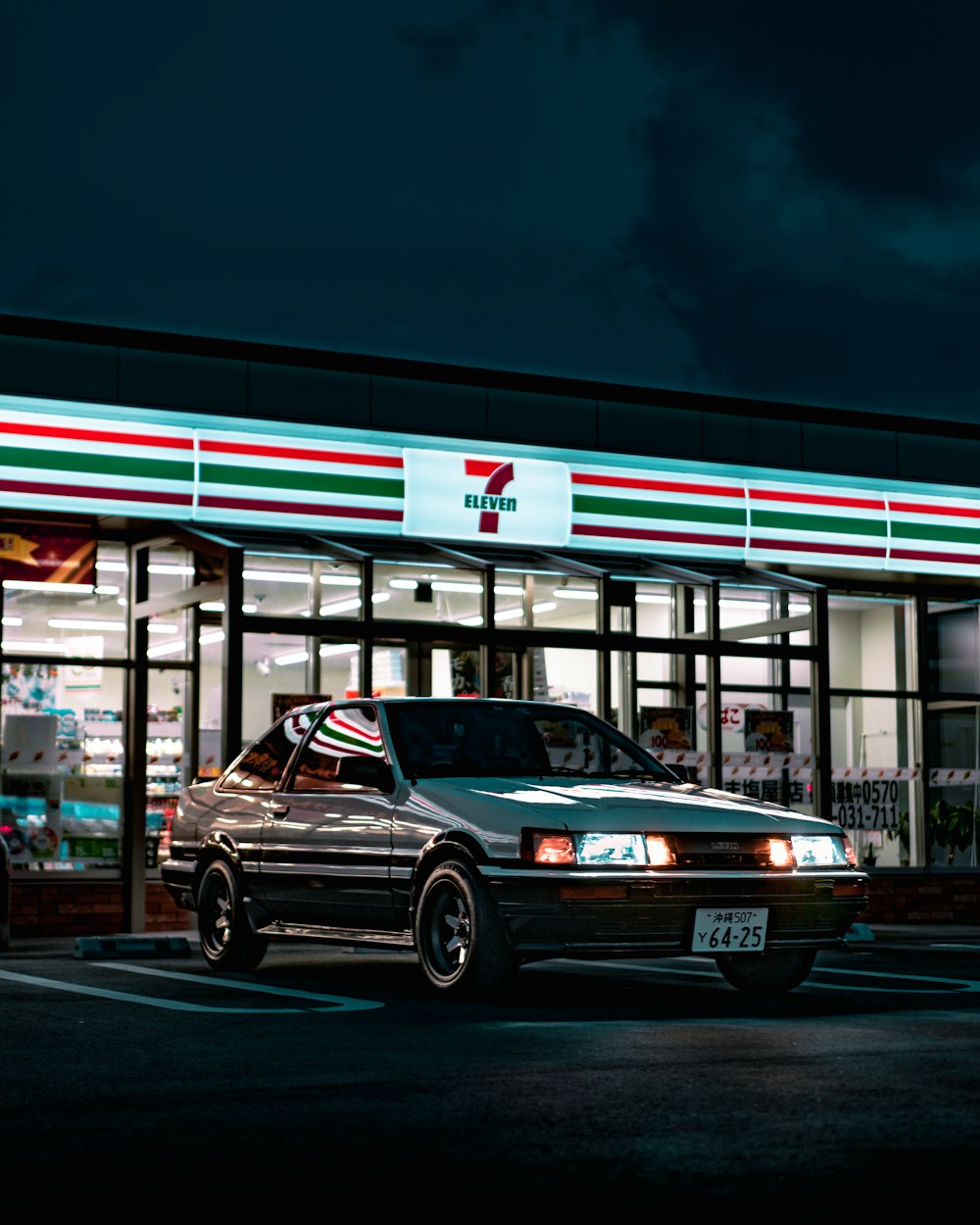 a car parked in front of a gas station