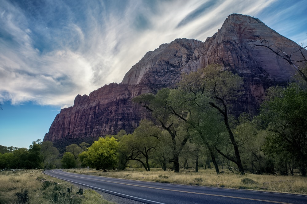 a road with a mountain in the background