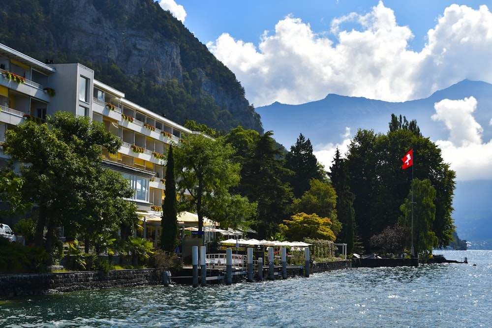 a body of water surrounded by trees and buildings