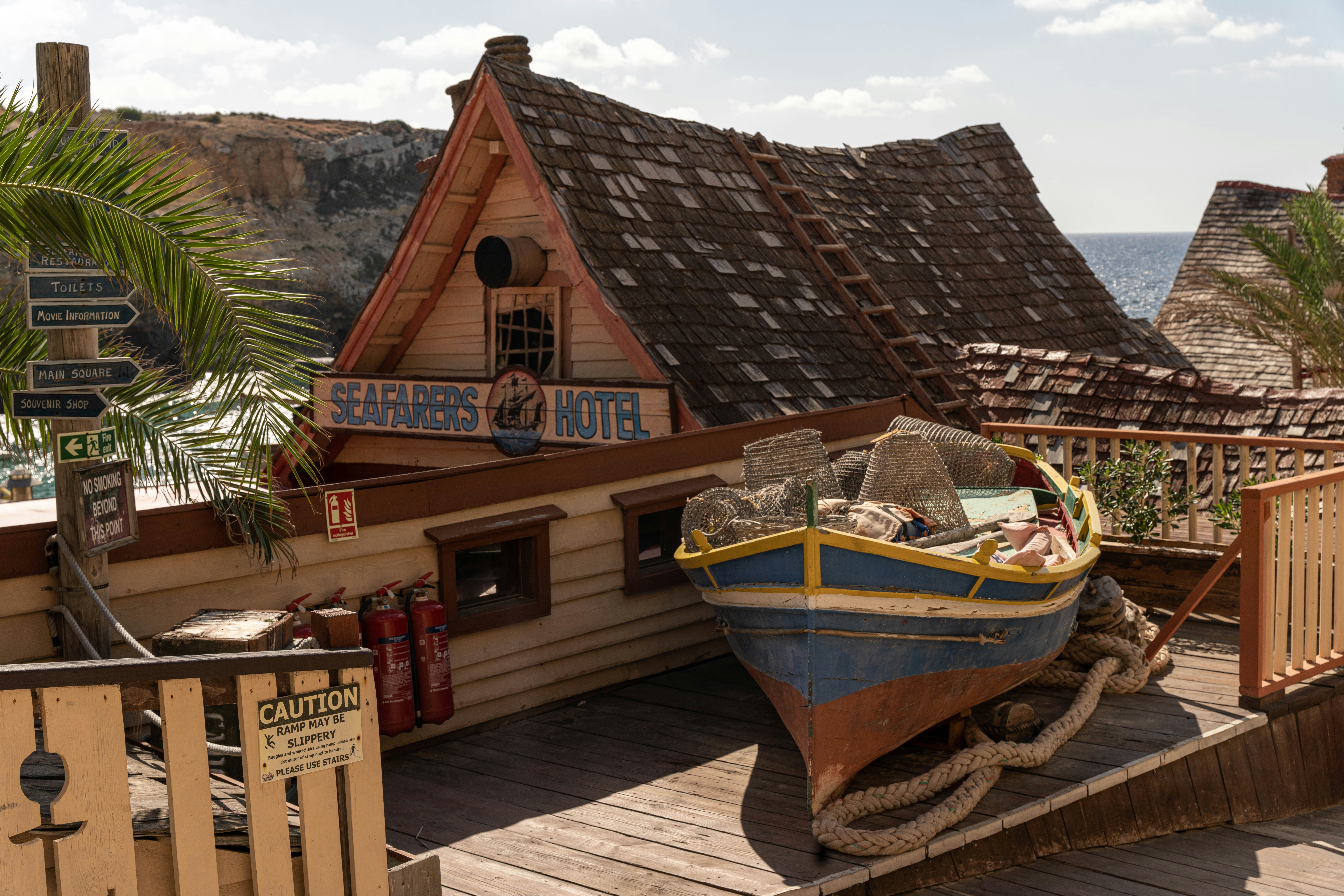 a boat sitting on top of a wooden dock