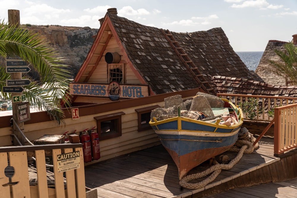 a boat sitting on top of a wooden dock