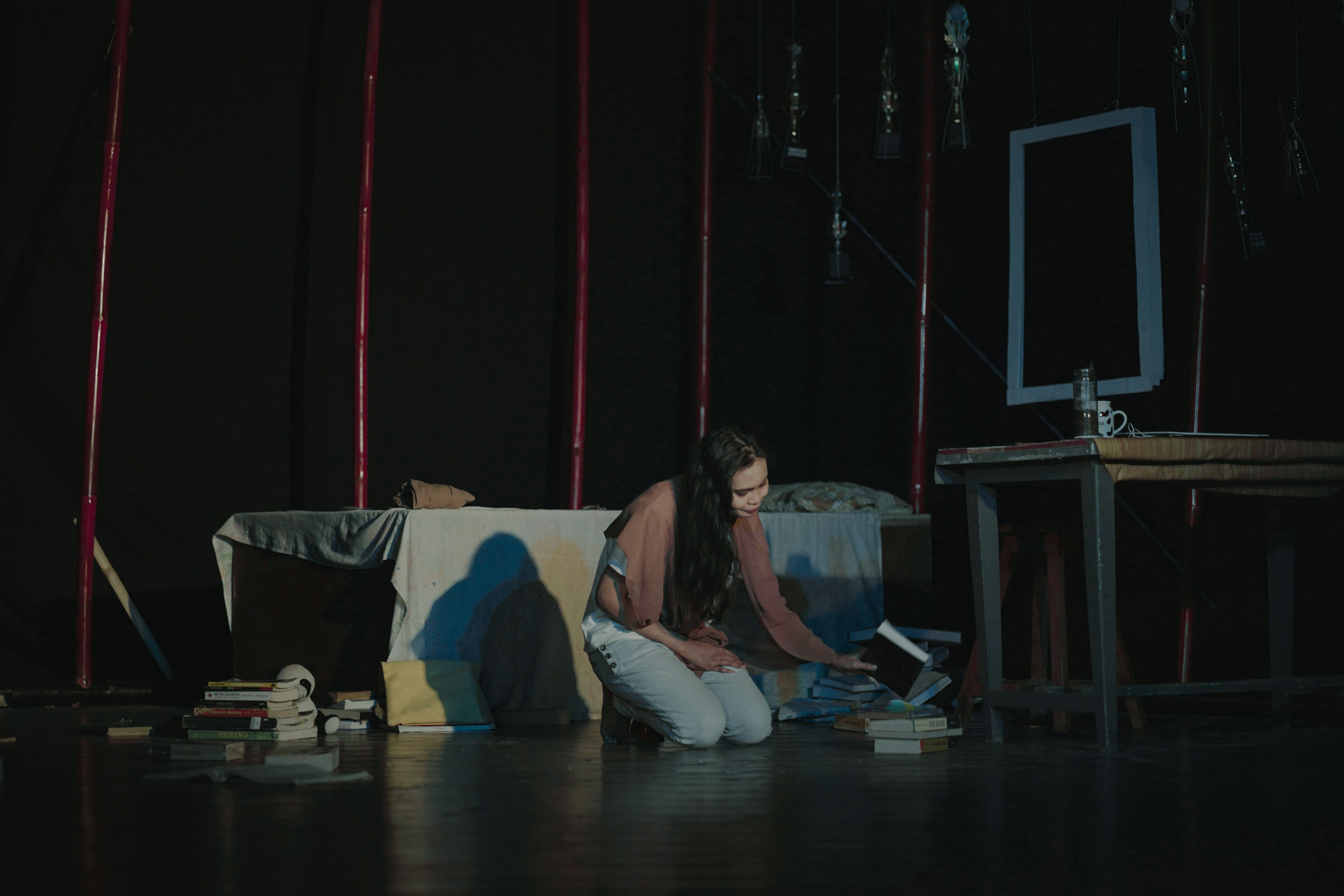 A stage picture portrayal of a girl oppressed by her family's educational system