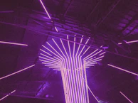 The full 'Projekt Ayame' piece illuminated by soft blue and purple neon lights, emphasizing its futuristic design.