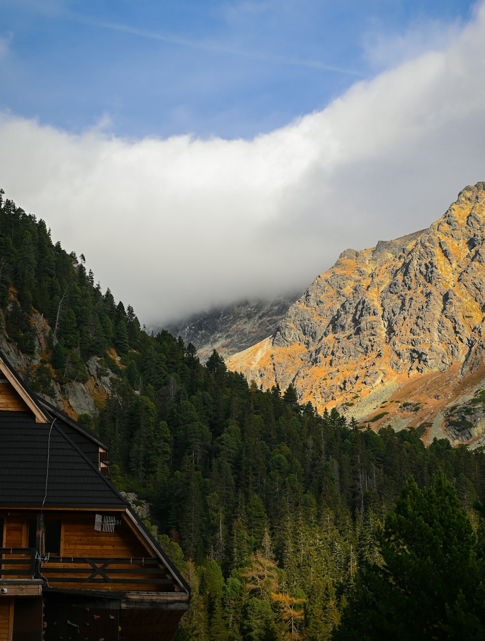 a house with a mountain in the background