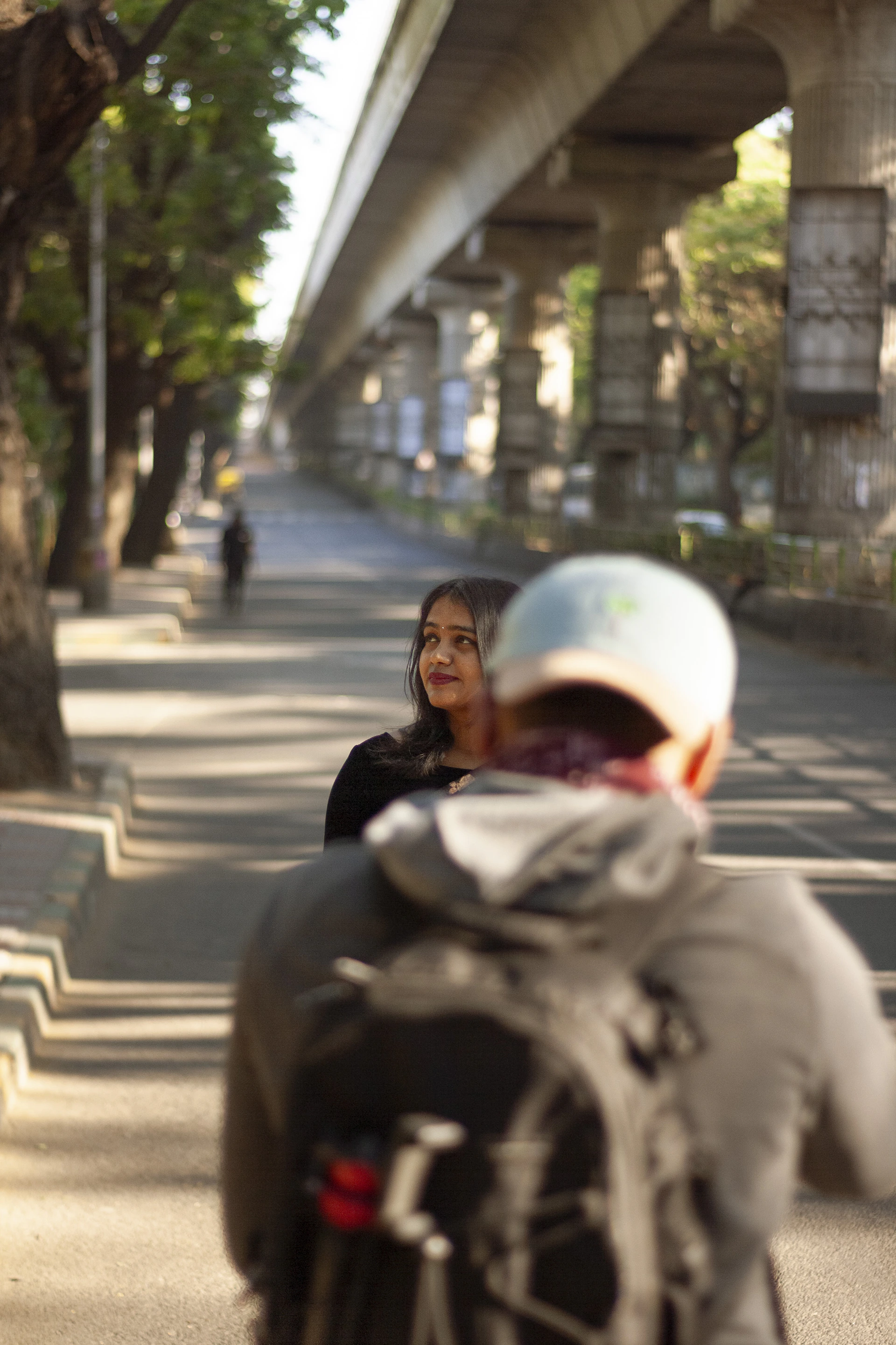 woman wearing yellow long-sleeved dress under white clouds and blue sky during daytime