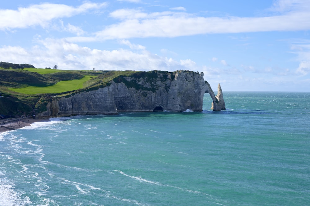 a large body of water next to a cliff