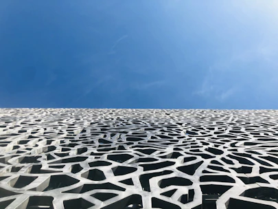 a very tall building with a sky in the background