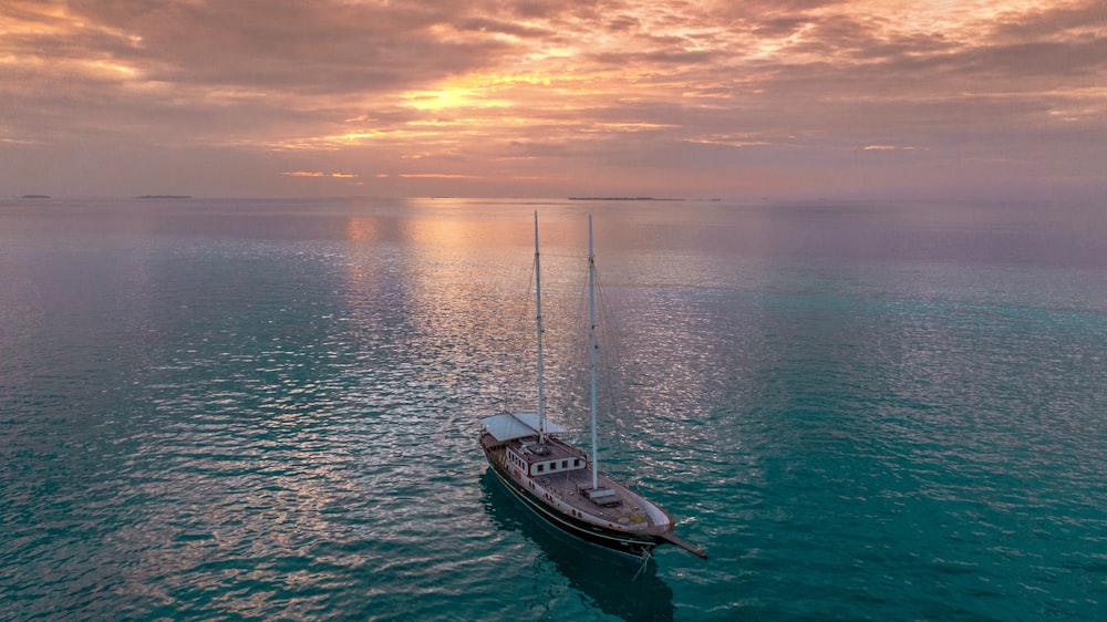 a boat floating on top of a large body of water