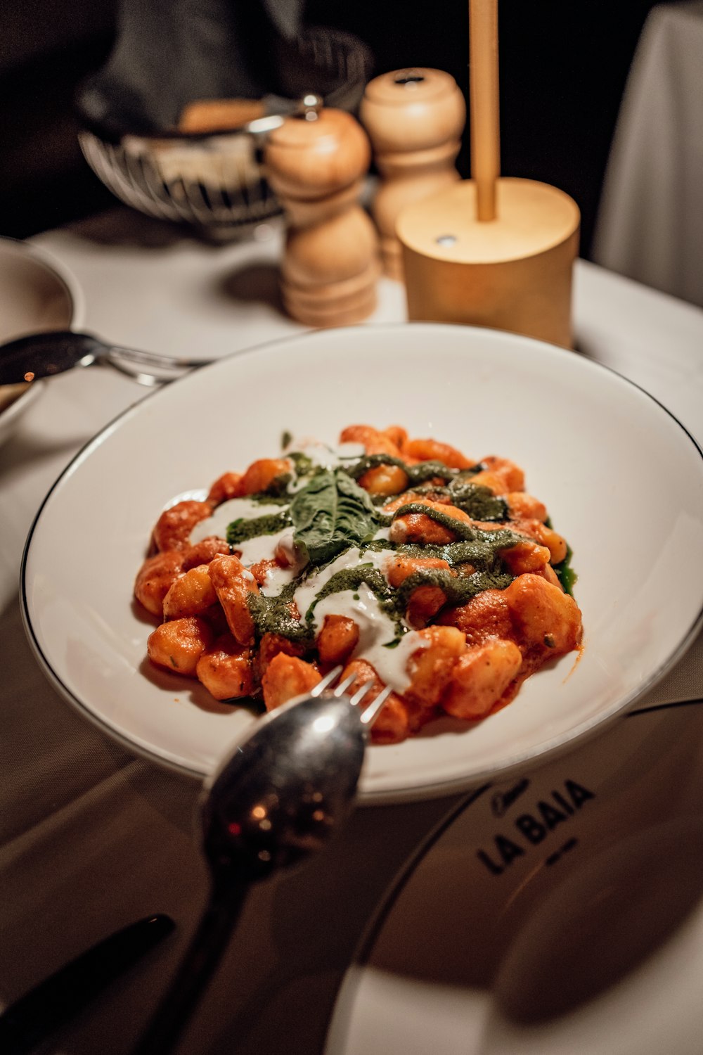 a white plate topped with pasta and sauce