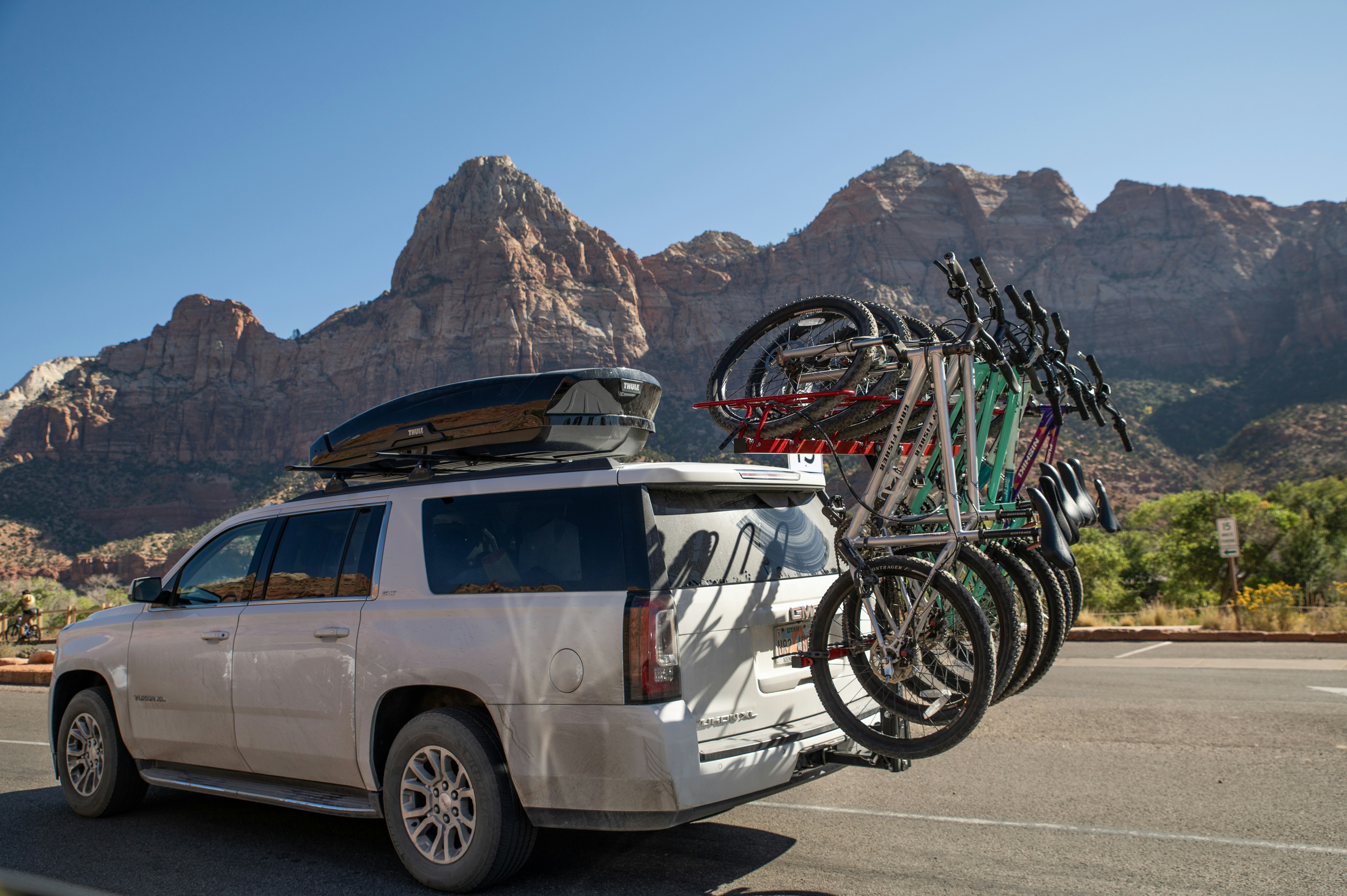 a car with a rack of bicycles on the roof