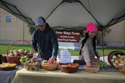 A group of local farmers gathered around a table, sharing ideas and plans for the new co-operative feed store.