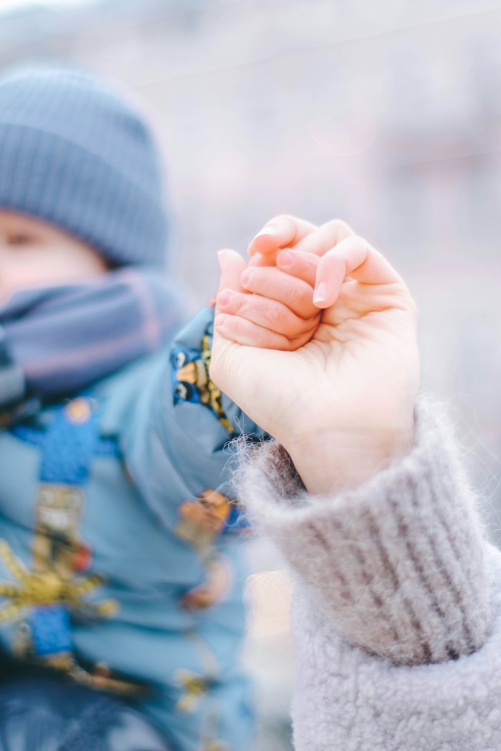 a small child is holding something up in the air