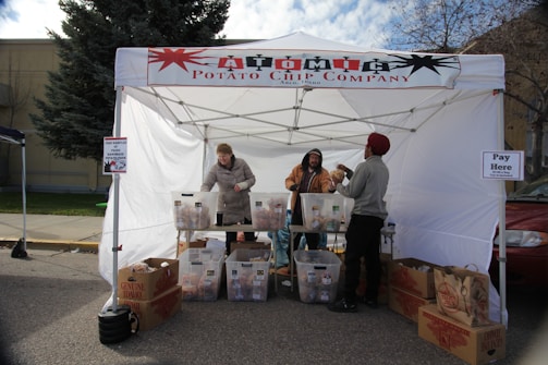 A hoso marketing representative handing out product samples at a crowded college campus.