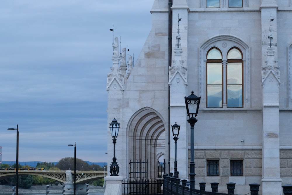 a large white building with a clock on it's side