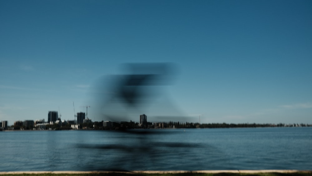 a blurry photo of a city and a body of water