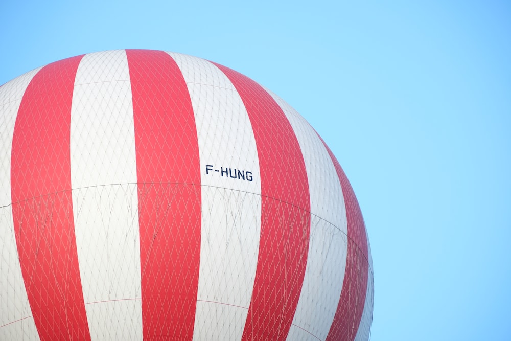 a large red and white striped hot air balloon