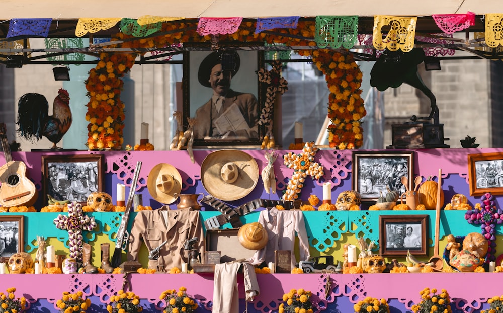 a display of hats and pictures on a wall