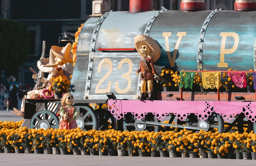 a train decorated with fake flowers and decorations