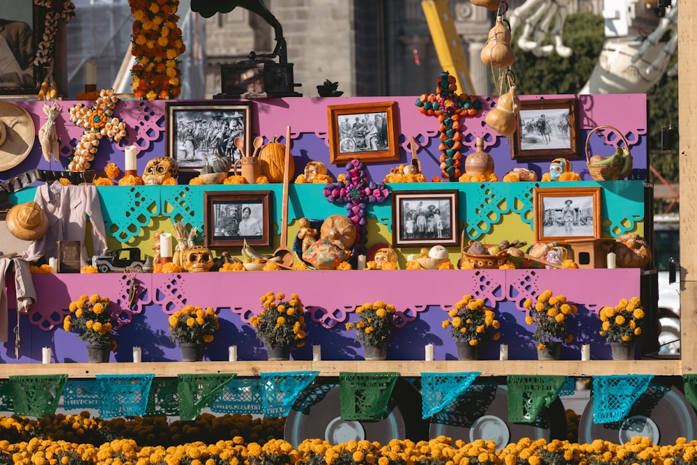 a colorful display with pictures and flowers on it