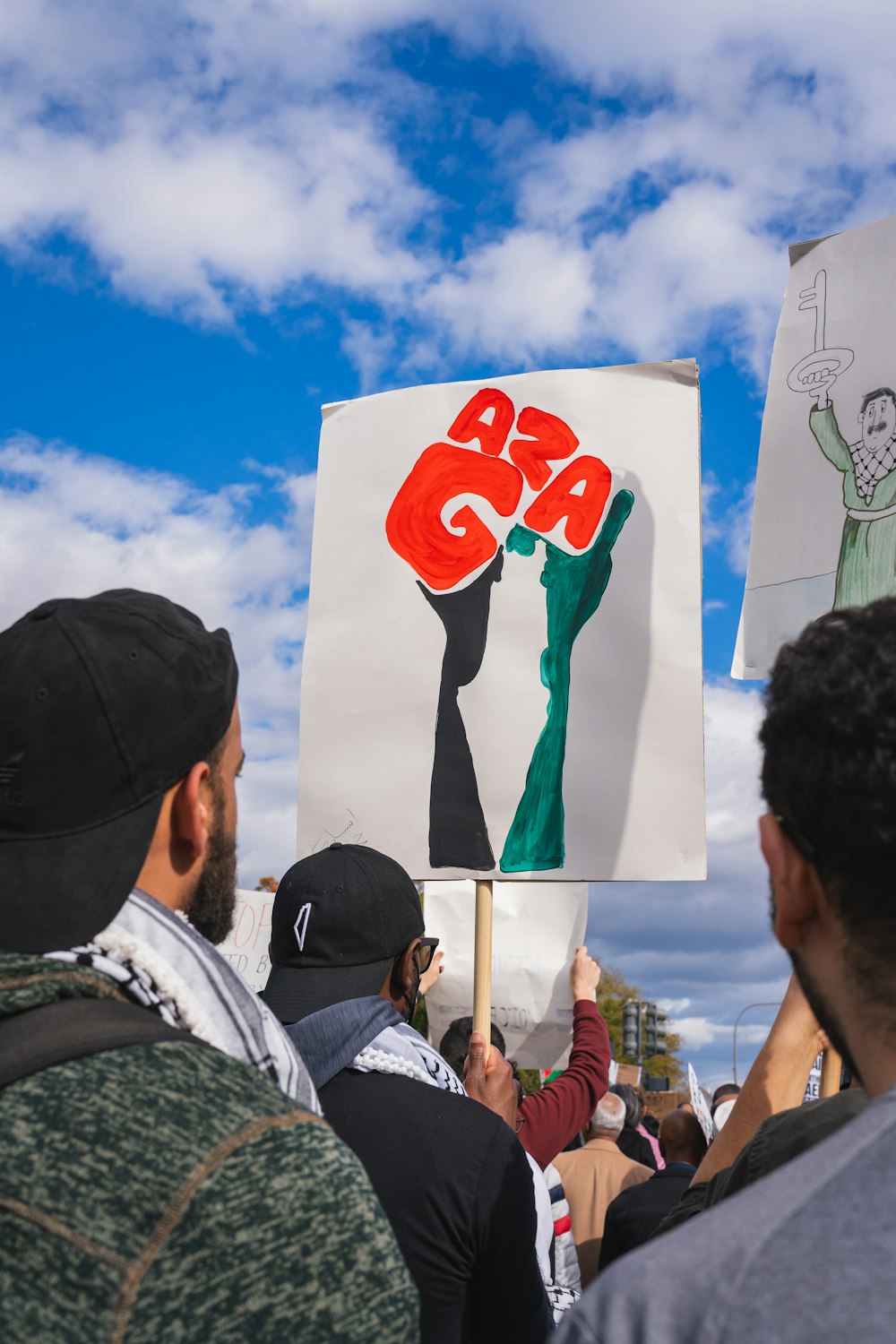 a group of people holding a protest sign