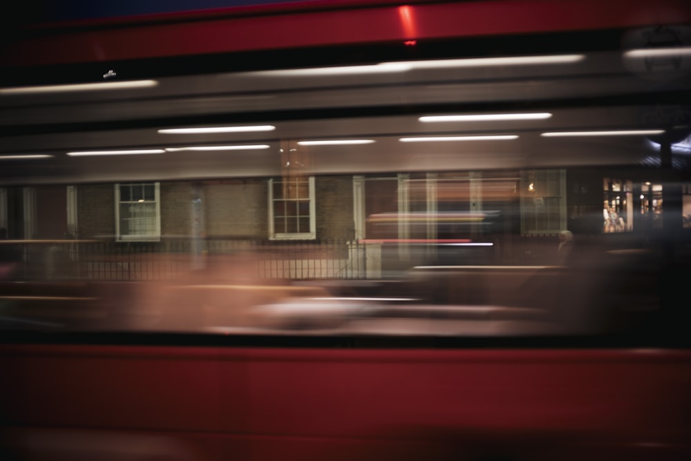 a blurry photo of a building with cars parked in front of it