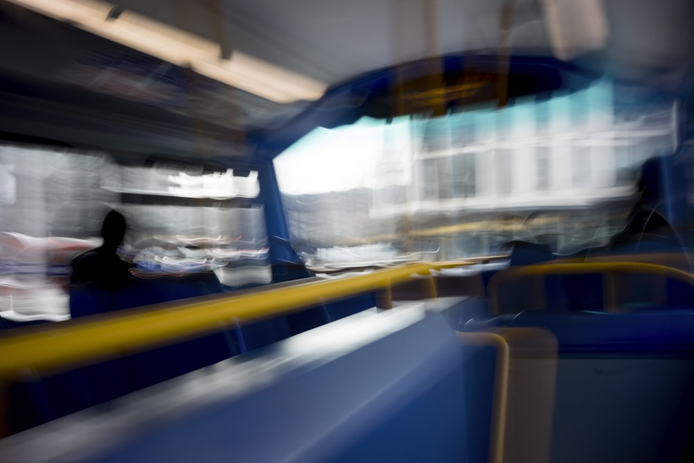 a blurry photo of a person sitting on a bus