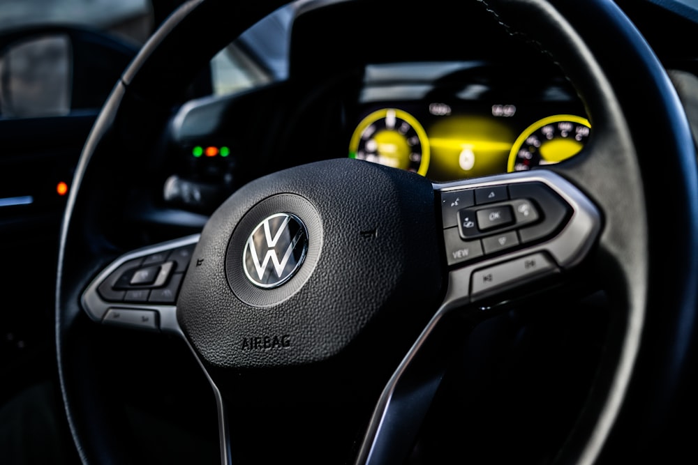 a steering wheel and dashboard of a car