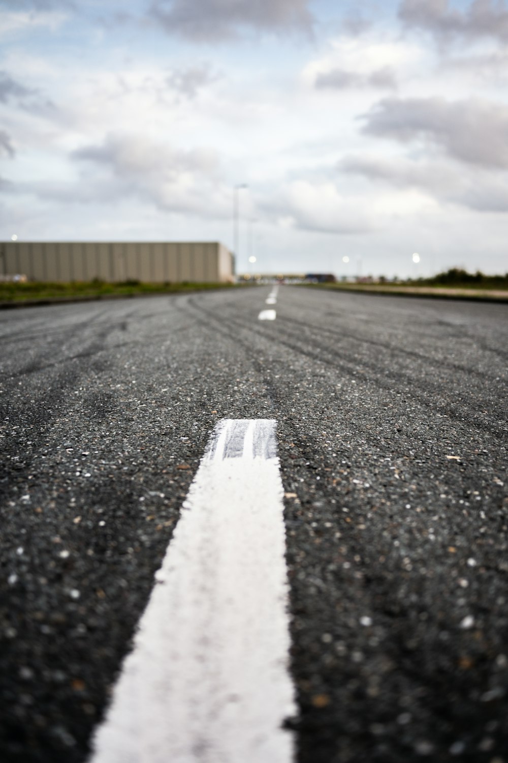 a white line on the middle of an empty road